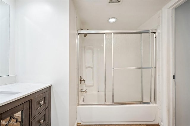 3665 Marcella Ave, Stow, OH 44224 - bathroom featuring vanity, bath / shower combo with glass door, and recessed lighting