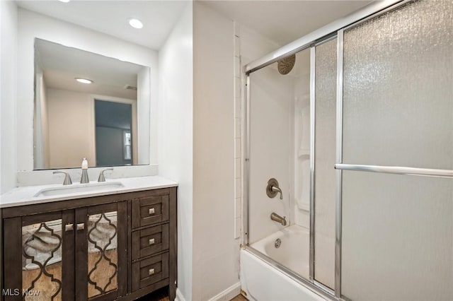 3665 Marcella Ave, Stow, OH 44224 - bathroom featuring baseboards, shower / bath combination with glass door, recessed lighting, and vanity