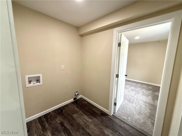 clothes washing area featuring baseboards, dark wood-style flooring, laundry area, and hookup for a washing machine