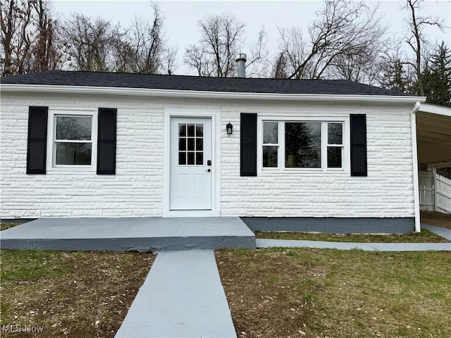 view of front of house with a shingled roof