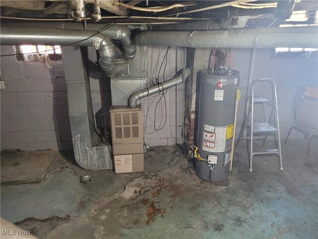 utility room featuring water heater and heating unit
