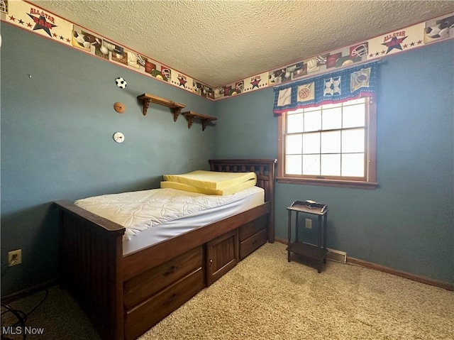 bedroom with baseboards, carpet, and a textured ceiling