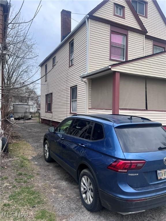 536 E 123rd St, Cleveland, OH 44108 - view of side of home with a chimney