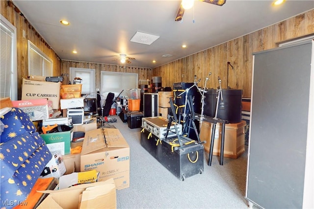 garage with wood walls, recessed lighting, and a ceiling fan