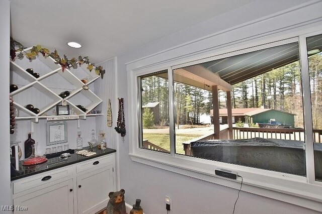 1208 Berwyn Dr SW, Sherrodsville, OH 44675 - doorway to outside featuring healthy amount of natural light and vaulted ceiling