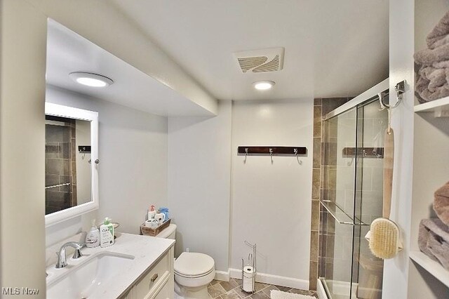 1208 Berwyn Dr SW, Sherrodsville, OH 44675 - full bath with a stall shower, toilet, vanity, baseboards, and tile patterned flooring