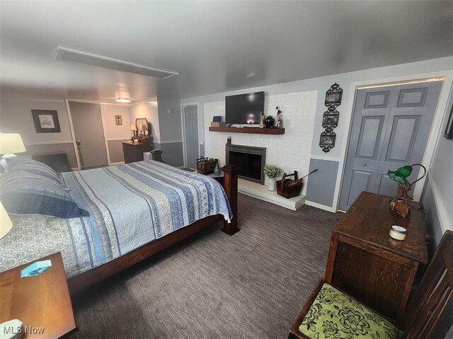 1208 Berwyn Dr SW, Sherrodsville, OH 44675 - carpeted bedroom featuring a brick fireplace
