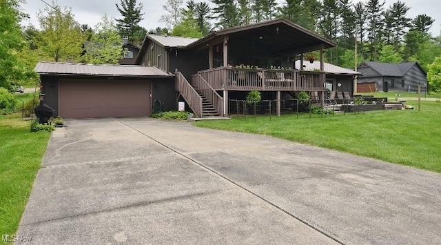 1208 Berwyn Dr SW, Sherrodsville, OH 44675 - view of front of property with a front yard, metal roof, concrete driveway, and a garage