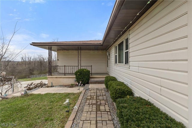 view of yard with covered porch