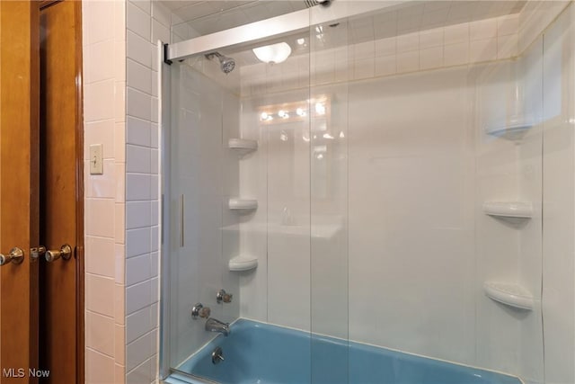 full bathroom with bath / shower combo with glass door