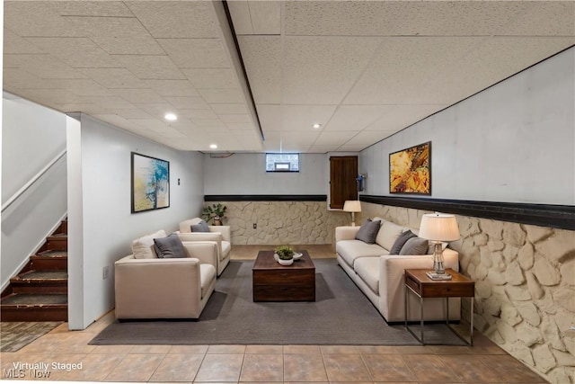 living room with recessed lighting, wainscoting, stairs, and a drop ceiling