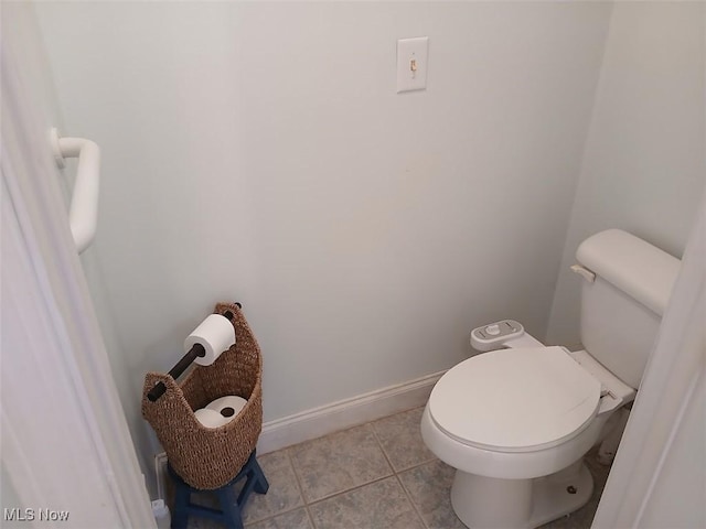 25977 E Hornsby Rd, Coolville, OH 45723 - bathroom with tile patterned floors, toilet, and baseboards