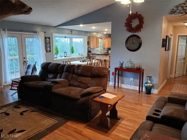 25977 E Hornsby Rd, Coolville, OH 45723 - living area featuring french doors, baseboards, vaulted ceiling, and light wood-type flooring