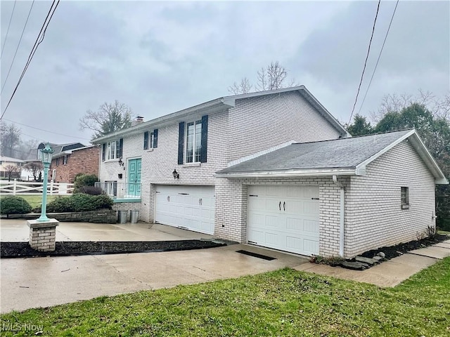 218 W Blvd, Mingo Junction, OH 43938 - view of front of home featuring brick siding and a garage