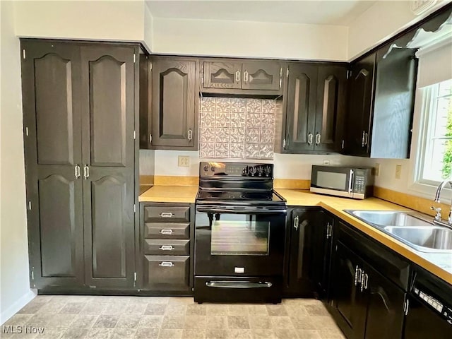 218 W Blvd, Mingo Junction, OH 43938 - kitchen with light countertops, a sink, and black appliances