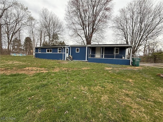 view of front of property with a front yard and entry steps