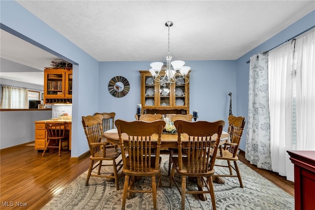 2816 Quail Run Ct, Lexington, OH 44904 - dining area with wood finished floors and a chandelier