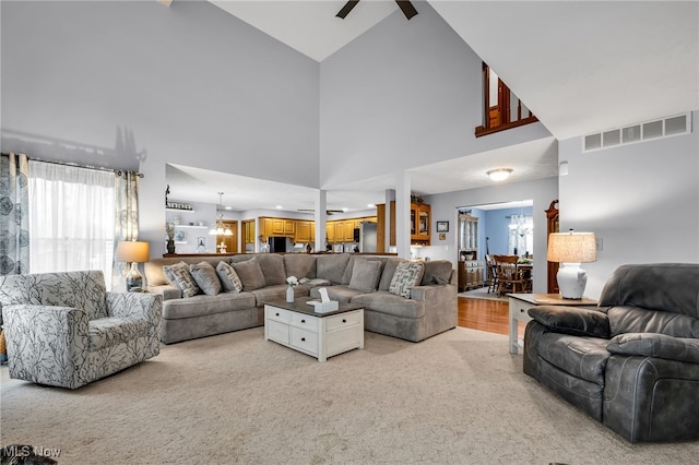 2816 Quail Run Ct, Lexington, OH 44904 - carpeted living room with high vaulted ceiling and ceiling fan