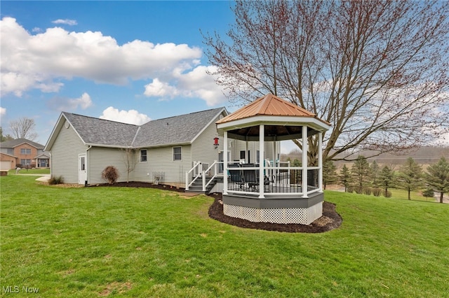2816 Quail Run Ct, Lexington, OH 44904 - rear view of property with a gazebo, a lawn, a wooden deck, and roof with shingles