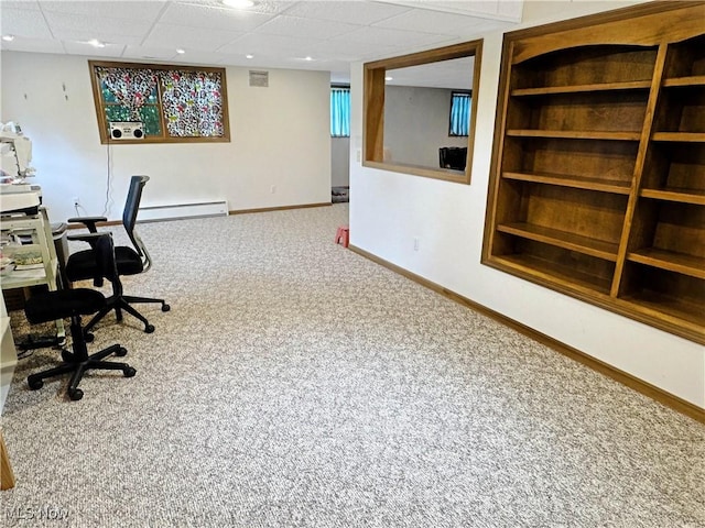2816 Quail Run Ct, Lexington, OH 44904 - carpeted home office featuring built in shelves, baseboards, a baseboard heating unit, and a drop ceiling