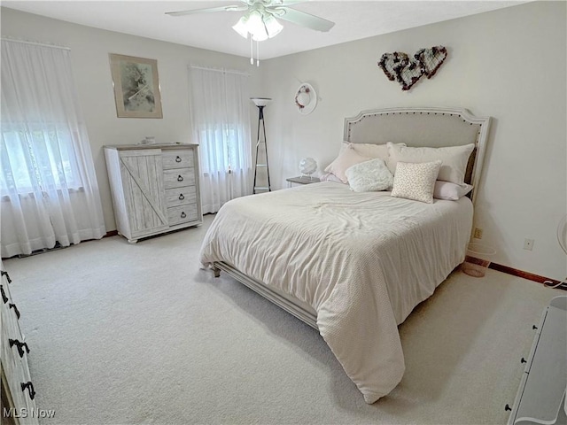 2816 Quail Run Ct, Lexington, OH 44904 - carpeted bedroom with multiple windows, ceiling fan, and baseboards