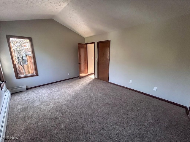 3013 Whispering Pines Dr, Canfield, OH 44406 - interior space with a textured ceiling, baseboards, a baseboard radiator, lofted ceiling, and carpet flooring