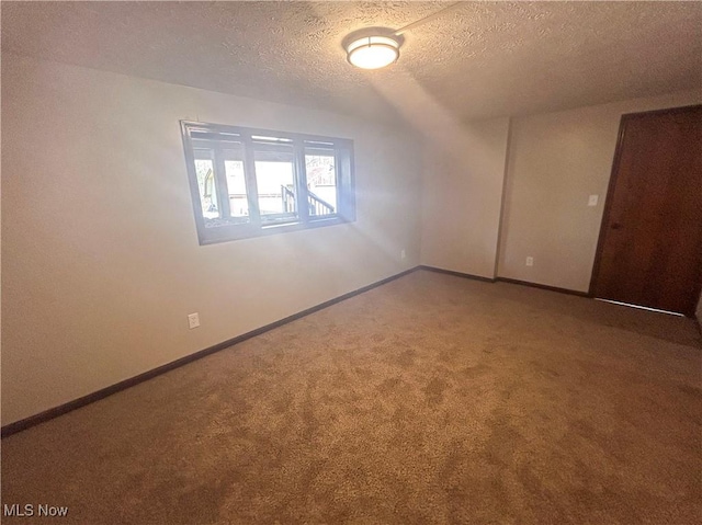 3013 Whispering Pines Dr, Canfield, OH 44406 - empty room with baseboards, carpet flooring, and a textured ceiling