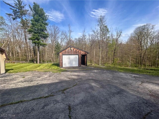 3013 Whispering Pines Dr, Canfield, OH 44406 - detached garage featuring a view of trees and aphalt driveway