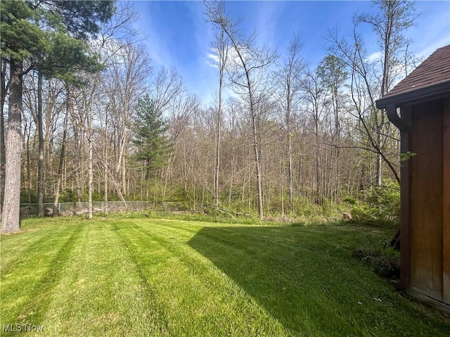 3013 Whispering Pines Dr, Canfield, OH 44406 - view of yard featuring fence and a forest view