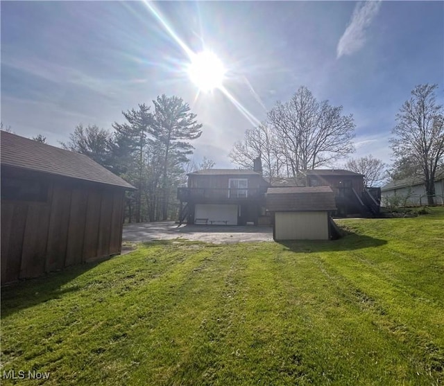 3013 Whispering Pines Dr, Canfield, OH 44406 - back of property featuring an outdoor structure, a shed, a yard, and a chimney