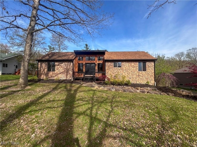 3013 Whispering Pines Dr, Canfield, OH 44406 - ranch-style home featuring a front yard and stone siding