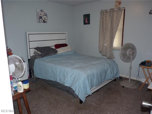bedroom featuring baseboards and carpet flooring