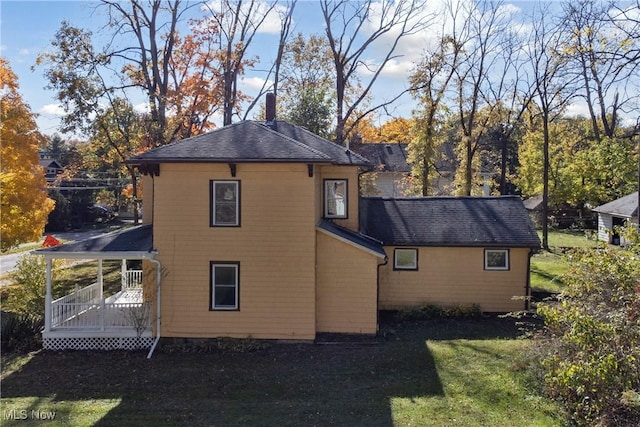 34 N Park St, Oberlin, OH 44074 - back of property with a chimney and a yard