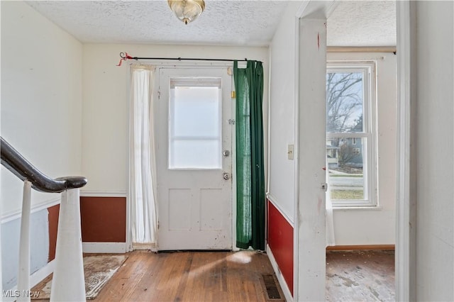 34 N Park St, Oberlin, OH 44074 - entryway featuring baseboards, a textured ceiling, and hardwood / wood-style flooring