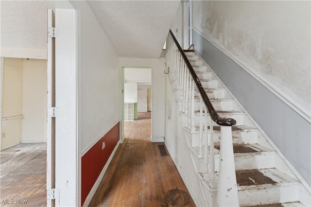 34 N Park St, Oberlin, OH 44074 - stairs featuring a textured ceiling and wood finished floors