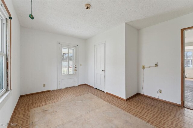 34 N Park St, Oberlin, OH 44074 - unfurnished room with a textured ceiling and baseboards