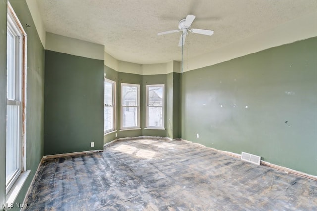 34 N Park St, Oberlin, OH 44074 - empty room with a textured ceiling, a ceiling fan, and baseboards