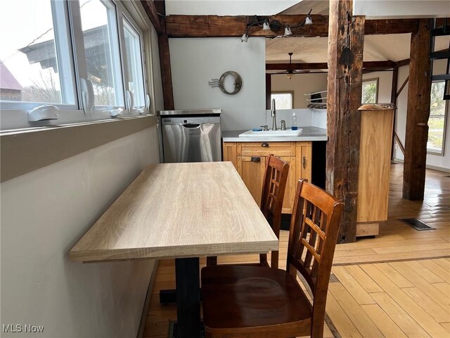 6232 Weaver Rd, Conneaut, OH 44030 - dining space featuring beamed ceiling, visible vents, light wood-style floors, and a ceiling fan