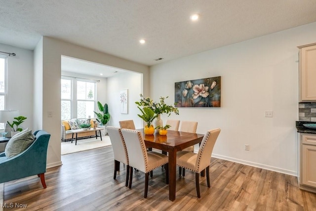 855-2 Dipper Ln, Aurora, OH 44202 - dining space featuring wood finished floors, recessed lighting, and a textured ceiling