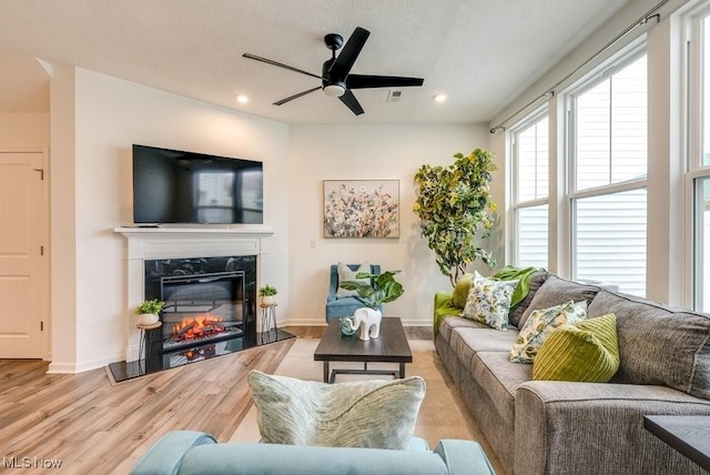 855-2 Dipper Ln, Aurora, OH 44202 - living room featuring ceiling fan, wood finished floors, a premium fireplace, and recessed lighting