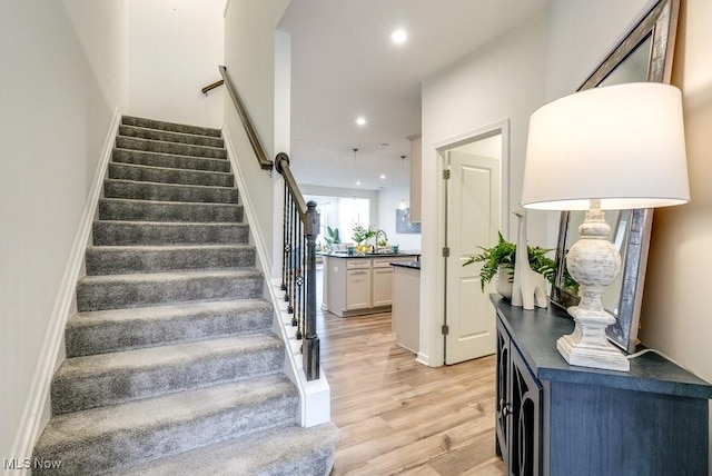 855-2 Dipper Ln, Aurora, OH 44202 - stairway with wood finished floors and recessed lighting
