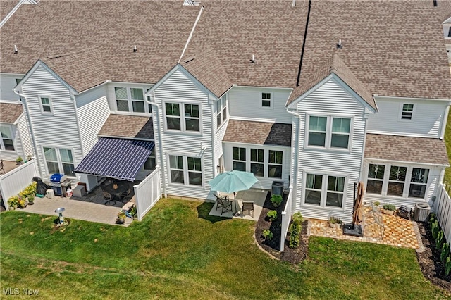 855-2 Dipper Ln, Aurora, OH 44202 - rear view of property with a patio area, a fenced backyard, and roof with shingles