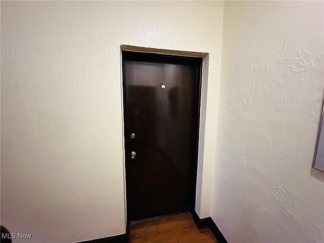 15610 Van Aken Blvd Unit 4, Shaker Heights, OH 44120 - doorway featuring wood finished floors and baseboards