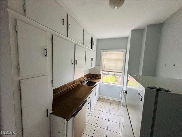 15610 Van Aken Blvd Unit 4, Shaker Heights, OH 44120 - kitchen featuring fridge, white cabinetry, dark countertops, and light tile patterned floors
