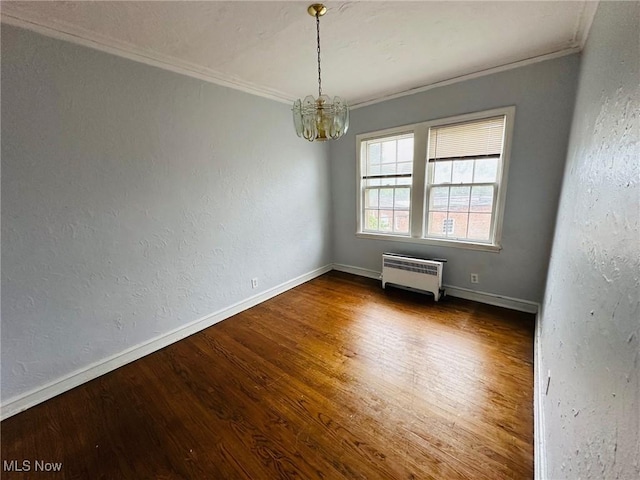 15610 Van Aken Blvd Unit 4, Shaker Heights, OH 44120 - unfurnished room with crown molding, a chandelier, radiator, and wood finished floors