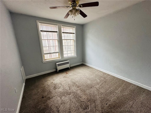 15610 Van Aken Blvd Unit 4, Shaker Heights, OH 44120 - empty room with carpet floors, ceiling fan, radiator, and a textured wall