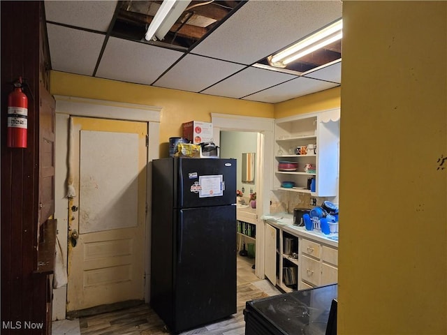 38 Royal Pl, Akron, OH 44310 - kitchen featuring light wood finished floors, open shelves, a paneled ceiling, and freestanding refrigerator