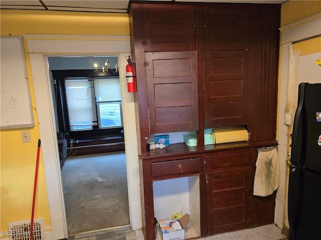 38 Royal Pl, Akron, OH 44310 - interior space featuring visible vents, light carpet, and freestanding refrigerator