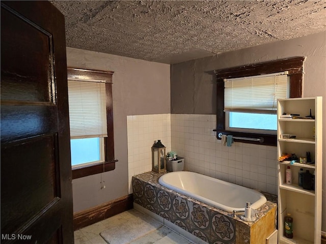 38 Royal Pl, Akron, OH 44310 - bathroom featuring baseboards and a garden tub