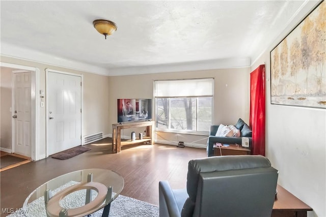17809 Harvard Ave, Cleveland, OH 44128 - living room with baseboards, visible vents, and wood finished floors
